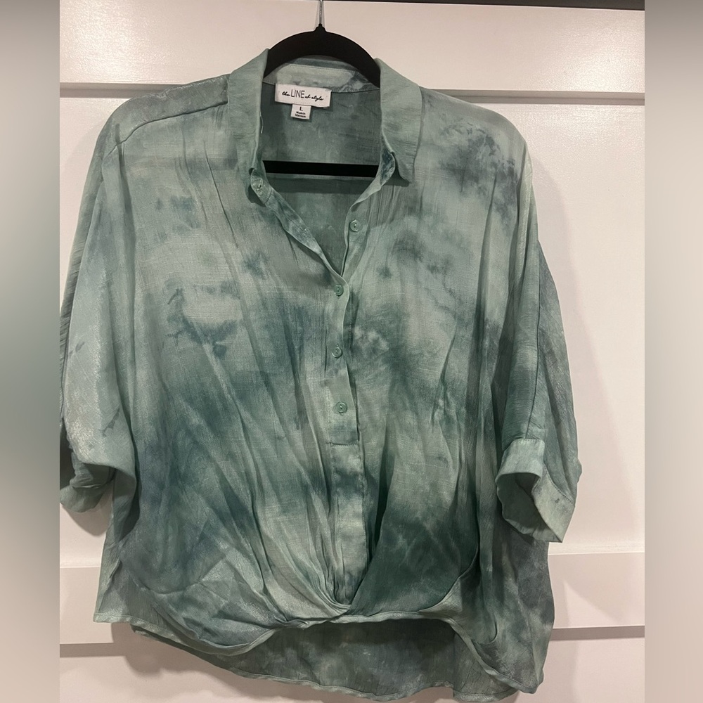 Cute button top with hi low feature with gauzy shimmer fabric
